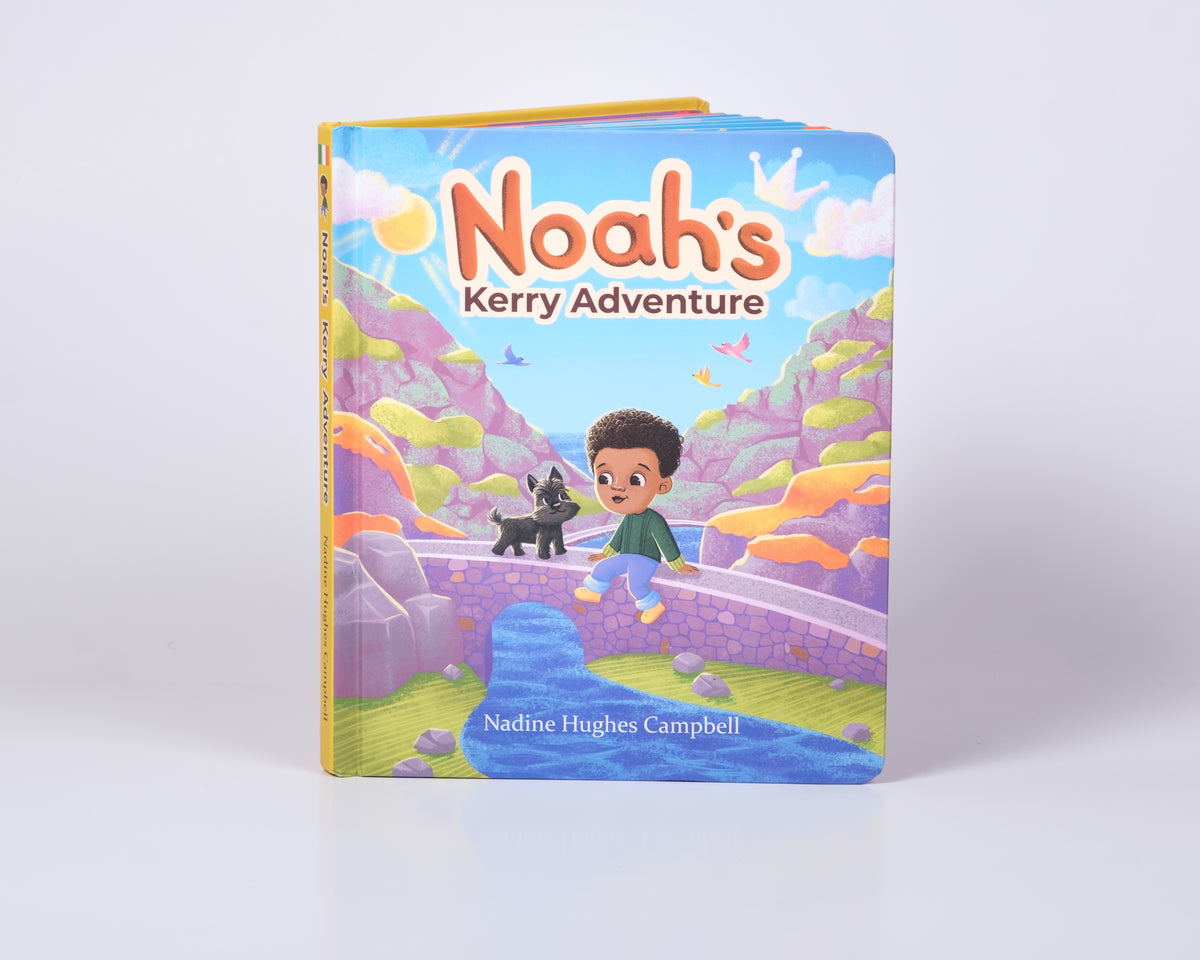 A hardcover children's book titled 'Noah's Kerry Adventure' by Nadine Hughes Campbell, featuring a colorful cartoon illustration of a boy, a black dog, and a stream on a bridge.